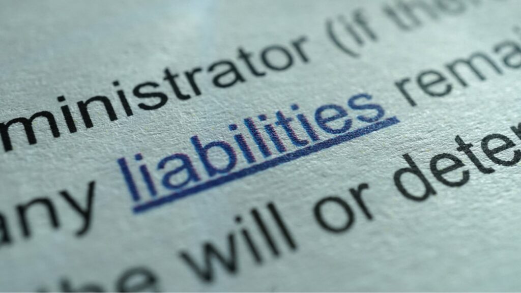 A Close-up of a Legal Paper With the Term “liabilities” Highlighted.
