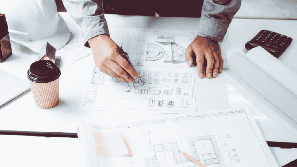 A contractor goes over the blueprints of a project.