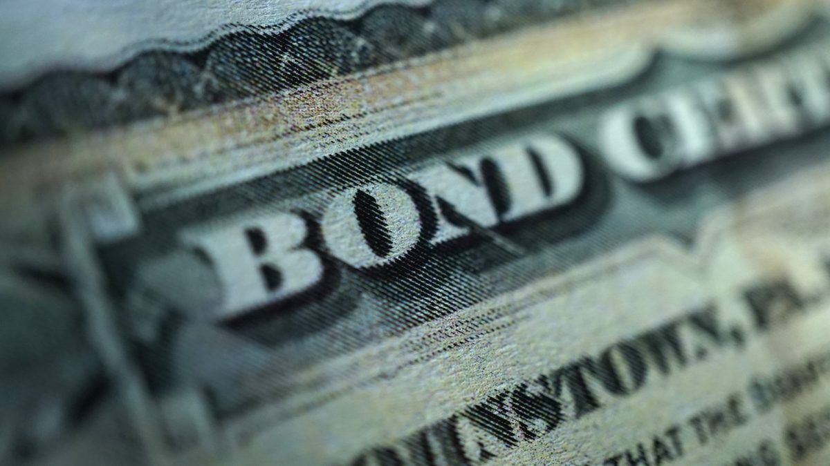 Close-up of an engraved bond certificate representing a QDOT trustee bond in California